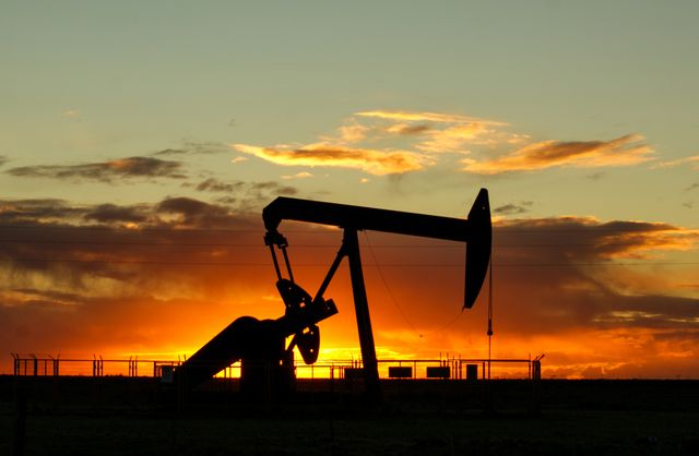 A pumpjack silhouetted against a sunset, from the Kestrel Wellsite example site